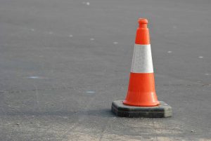 Red/Orange UK Road Traffic Cone on road